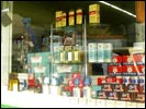 Period medicine/notion boxes and bottles in window of Rings Pharmacy